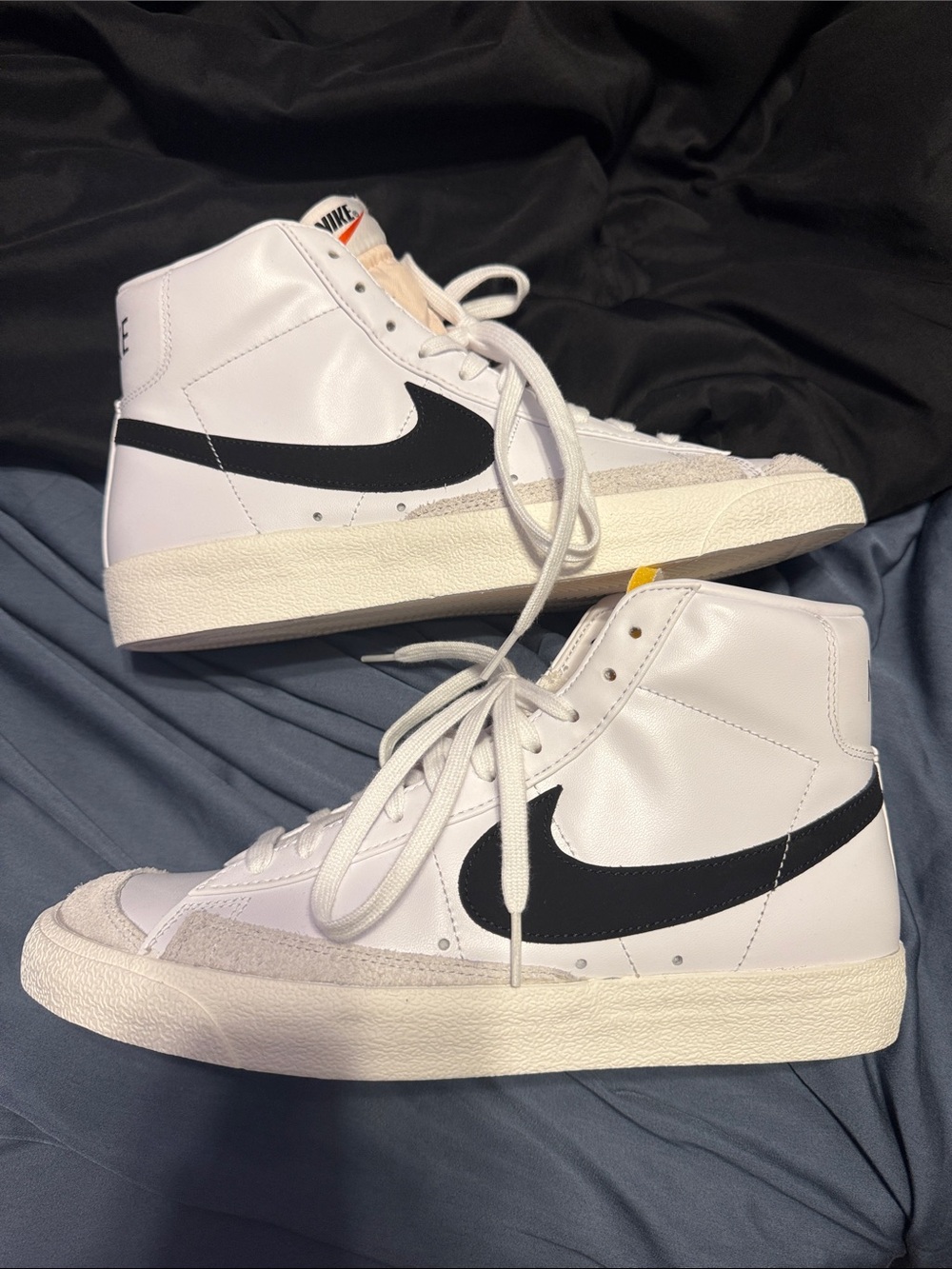 Nike White High-Top Sneakers with Black Swoosh